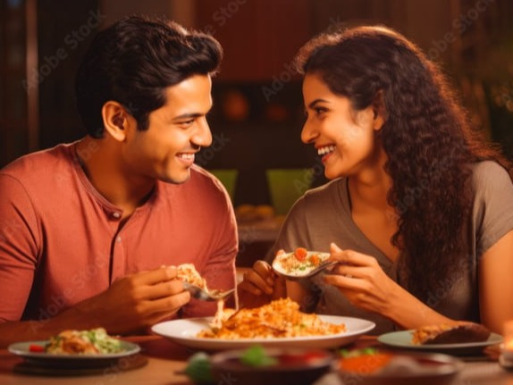 Couple eating indian food